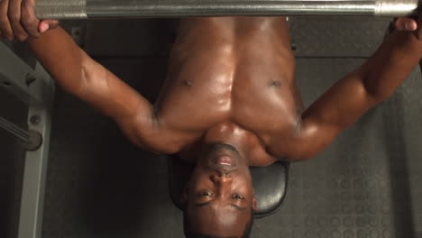 Above-view-of-a-fit-man-lifting-dumbbell