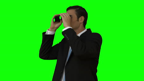 Businessman-looking-through-binoculars