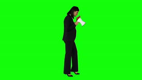 Businesswoman-speaking-in-megaphone-on-green-screen-