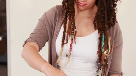 Woman-with-dreadlocks-cooking-in-the-kitchen