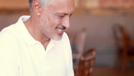 Happy-man-using-his-laptop-computer-