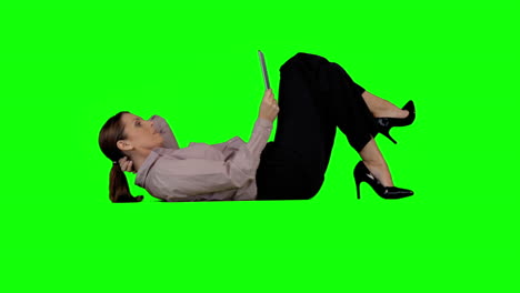 Businesswoman-using-tablet-against-green-screen