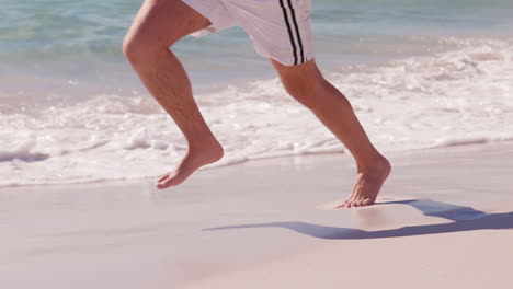 Man-running-at-the-beach