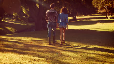 Cute-couple-walking-in-the-park-