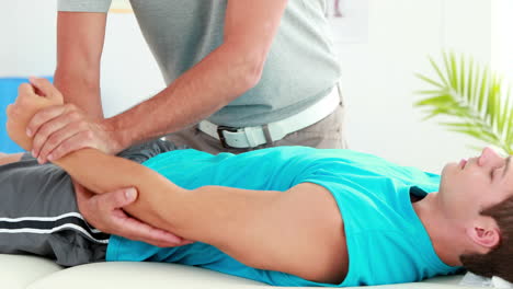 Physiotherapist-giving-sports-massage-to-patient