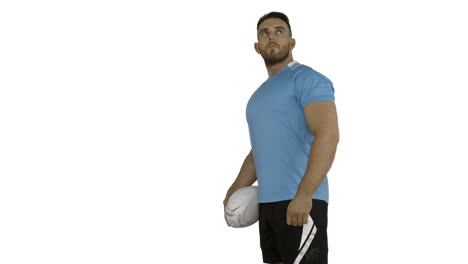 Serious-rugby-player-holding-ball