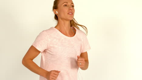 Female-athlete-running-on-a-white-background