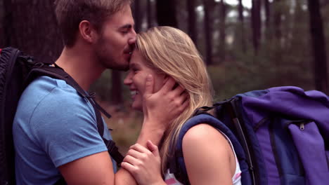 Couple-hiking-through-a-forest