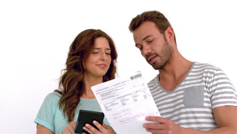Smiling-couple-calculating-bills