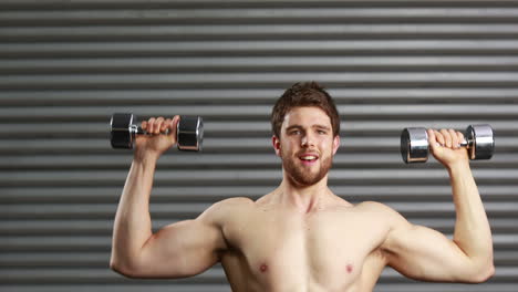 Concentrated-man-lifting-dumbbells-