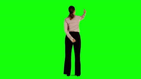 Businesswoman-interacting-with-green-screen