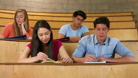Students-sitting-beside-each-other-while-learning