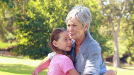 Happy-grandmother-hugging-her-granddaughter-