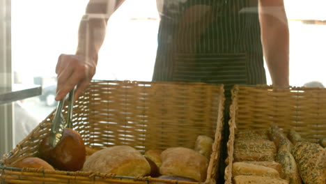 Baker-arranging-bread-in-baskets