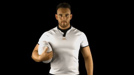 Serious-rugby-player-holds-rugby-ball