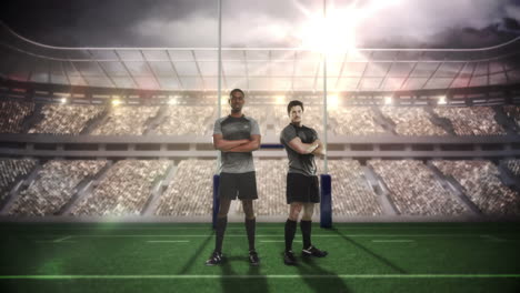 Serious-rugby-players-posing-in-front-of-goal-post