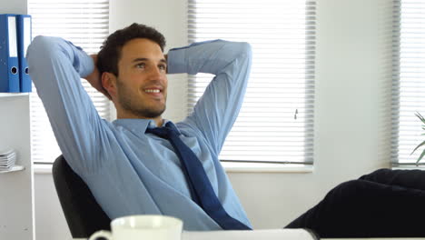 Businessman-relaxing-while-at-work