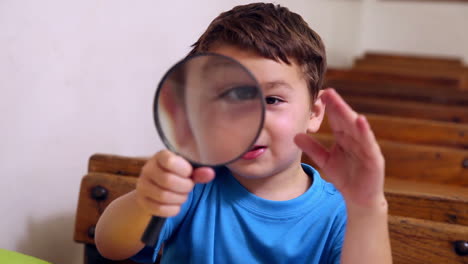 Cute-pupil-holding-magnifying-glass