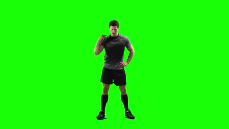 Serious-rugby-player-gesturing-in-front-of-camera-