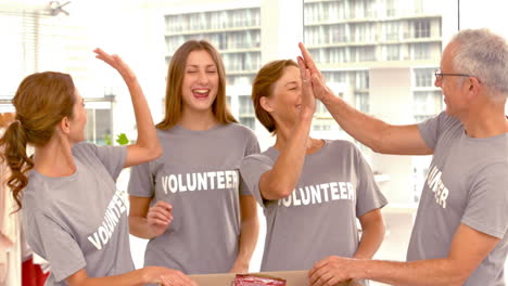 Group-of-Volunteers-doing-high-fives