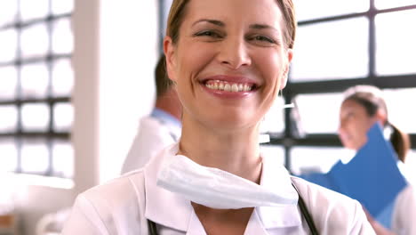 Female-doctor-smiling-at-camera