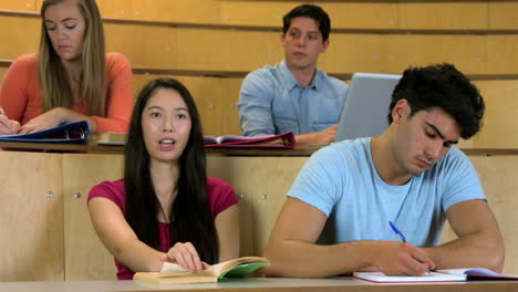 Students-sitting-beside-each-other-while-learning