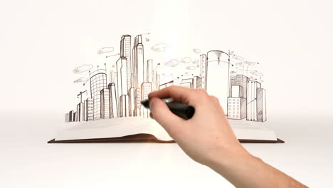 Book-opening-to-cityscape-sketch
