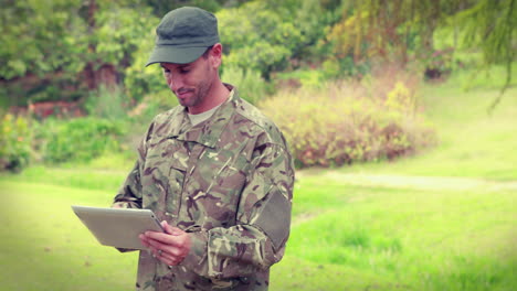 Happy-soldier-using-tablet-computer-