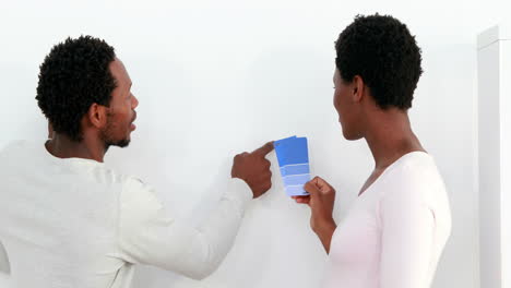 Standing-couple-looking-at-pallet-of-colors