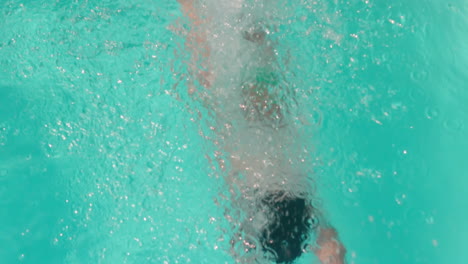 Attractive-woman-diving-in-the-pool