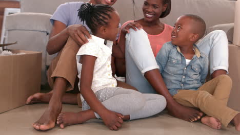 Family-sitting-in-new-home