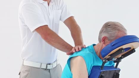 Doctor-massaging-his-patients-shoulders