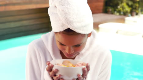 Attractive-woman-smelling-bowl