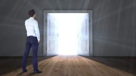 Door-opening-to-light-watched-by-businessman