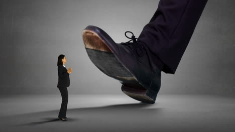 Shoes-of-giant-boss-trying-to-squash-businesswoman-