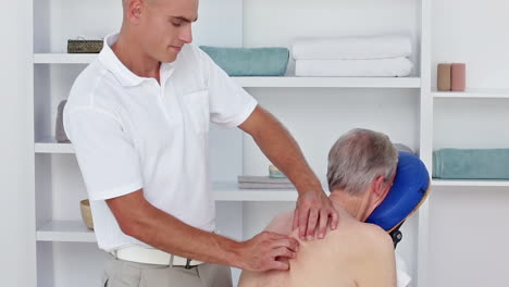 Doctor-massaging-his-patients-back