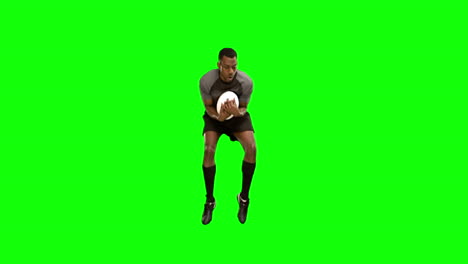Serious-rugby-player-catching-ball