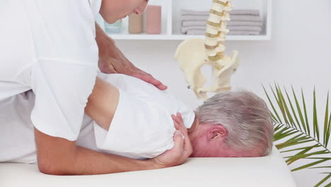 Doctor-massaging-his-patient-shoulder