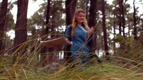 Woman-hiking-through-a-forest