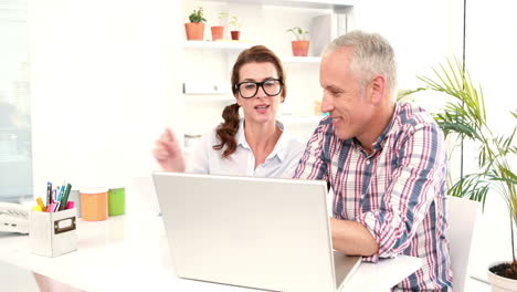 Casual-business-workers-using-laptop-computer