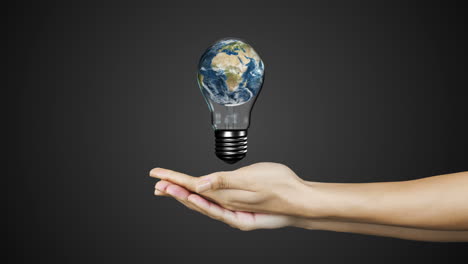 Hands-presenting-light-bulb-with-earth