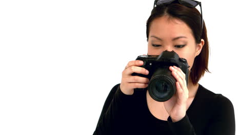 Asian-woman-using-professional-camera