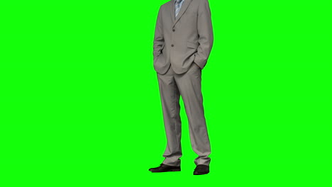 Businessman-standing-with-hands-in-pockets