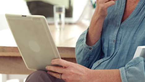 -Pretty-casual-worker-using-tablet-pc