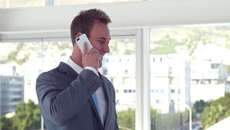 Handsome-businessman-having-a-phone-call