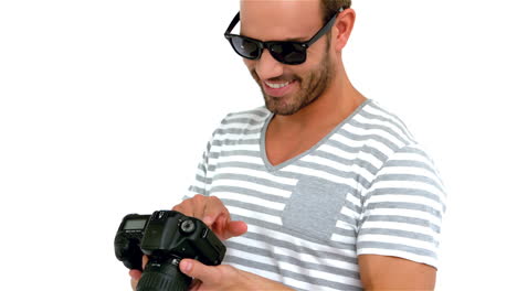 Smiling-man-using-professional-camera