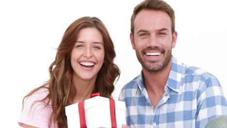 Smiling-man-offering-gift-to-his-girlfriend-
