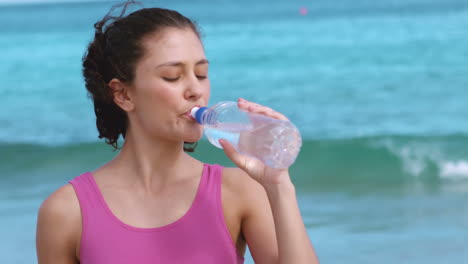 Fit-woman-drinking-bottle-of-water