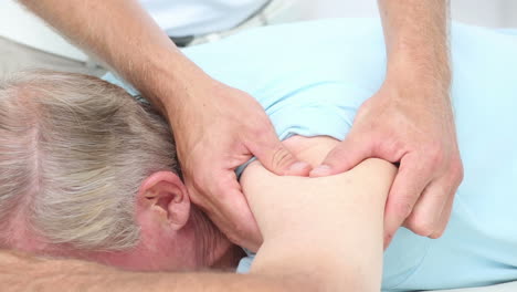 Doctor-massaging-his-patients-shoulder