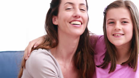 Mom-and-daughter-cuddling-at-home